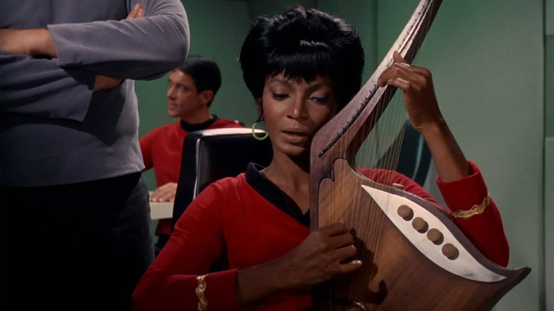 (CBS) Uhura accompanying herself on the lute
